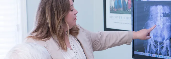 Chiropractor Hampton IL Laura Stone Pointing To Xray Chiropractor Hampton IL Laura Stone Pointing To Xray